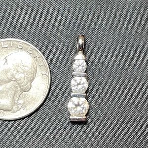 Gorgeous 3 stone simulated diamond pendant